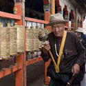 Pilgrims turning prayer wheels, Ramoche Temple, Lhasa, Tibet.