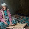 Nepalese woman with sick relative, Nepal.